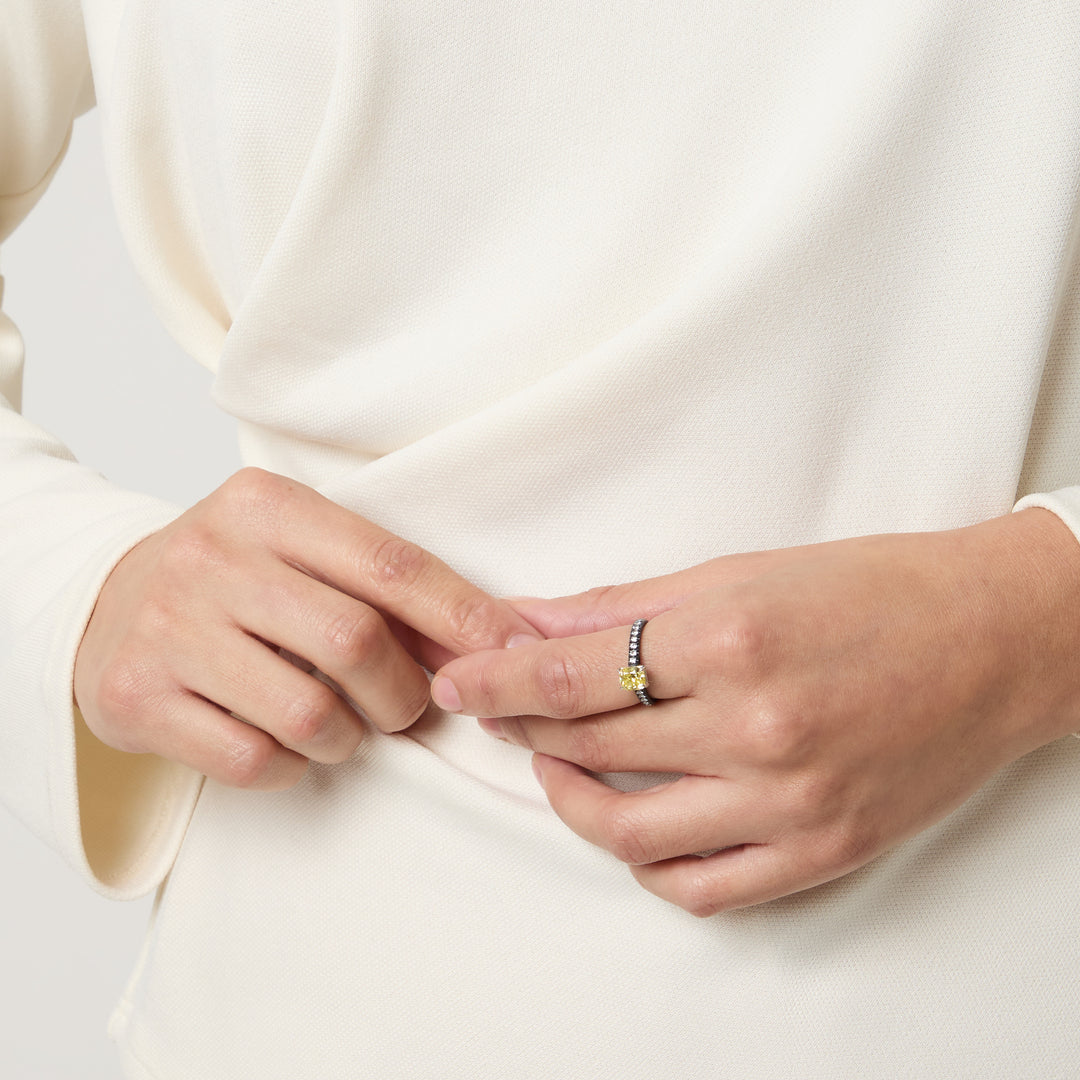 Eclipse Celeste Ring worn alone by model against neutral background