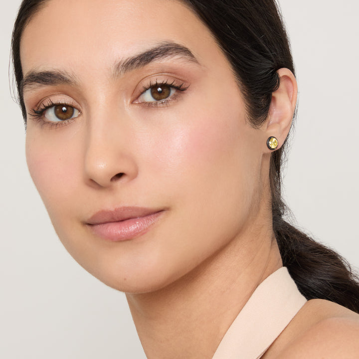 Model wearing Eclipse Black Luna Earrings shown in styled position