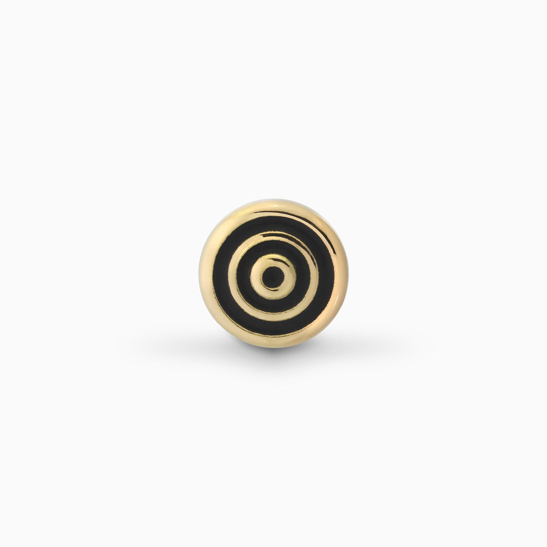 MARCO DAL MASO Acies Ipnotic Earring in yellow gold with black enamel, shown from the front to highlight its concentric circular design and contrasting gold and black detailing.