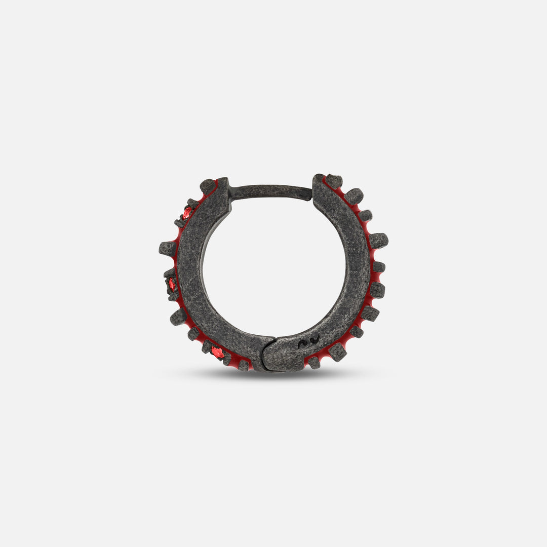 MARCO DAL MASO Acies Mini Pavé Hoop Earring in oxidized silver with red enamel and red sapphires, shown in a side-profile view highlighting the hoop structure and gemstone settings.