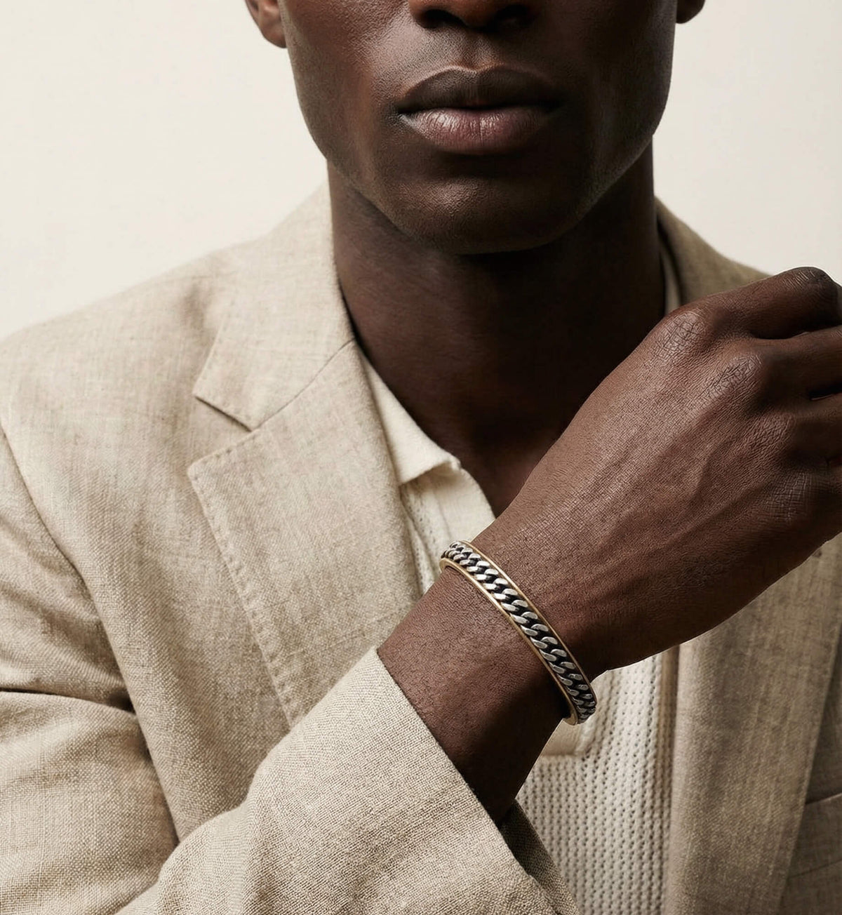 Ulysses Wide Chain Cuff in yellow gold vermeil and oxidized silver worn on the wrist.