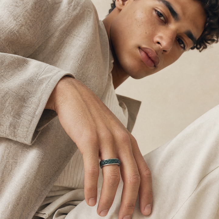 LASH Leather Braid Ring in silver and green leather, worn on the model's hand.
