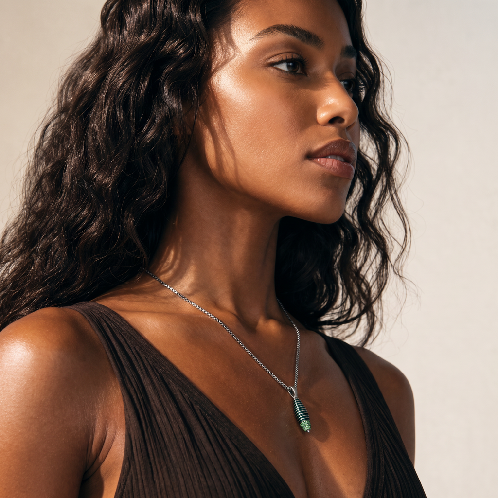 Model wearing the Acies Cocoon Gemstone Pendant in oxidized silver with green enamel and tsavorite garnet