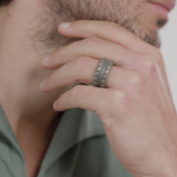 Video of a model wearing the Iron Snake oxidized silver ring on ring finger.