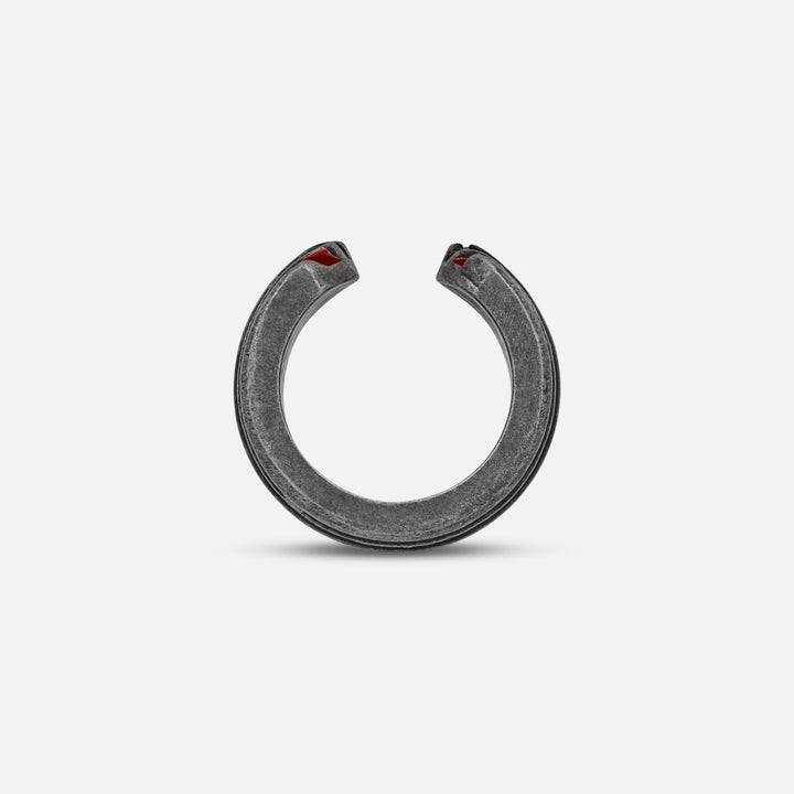 Top-down view of split band exposing crimson hints on a soft platform.