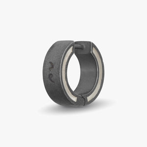 Dark gray hoop earring with a light-colored inner stripe.