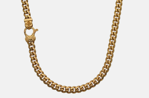 MARCO DAL MASO Flaming Tongue Cuban Link Necklace in yellow gold, featuring interlocking Cuban chain links and an ornate clasp, shown against a light background.