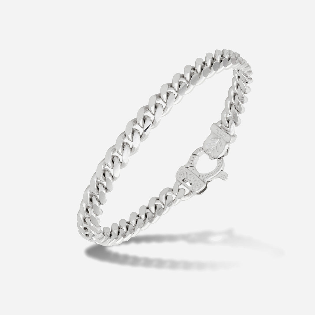 MARCO DAL MASO Flaming Tongue Polished Cuban Link Bracelet in polished silver, featuring interlocking chain links and an ornate clasp, shown in an angled product view against a light background.