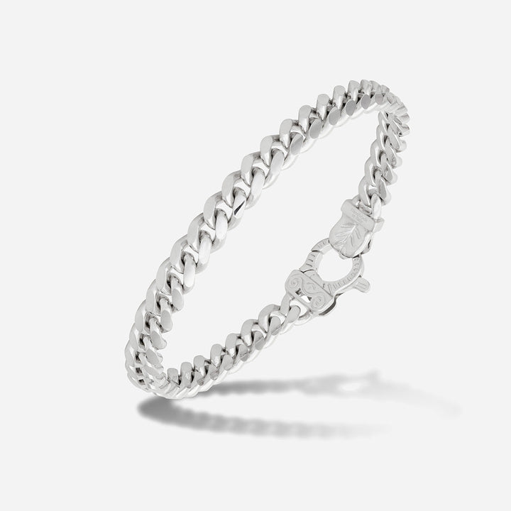 MARCO DAL MASO Flaming Tongue Polished Cuban Link Bracelet in polished silver, featuring interlocking chain links and an ornate clasp, shown in an angled product view against a light background.