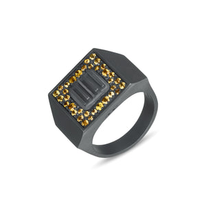 Dark gray signet ring with yellow stones around a ridged center.