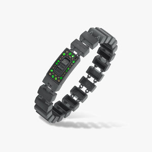 Dark link bracelet with a rectangular centerpiece and green stones.