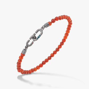 MARCO DAL MASO Link Mini Beads Eternity Bracelet featuring faceted carnelian beads and a dark metal link clasp, shown in an angled product view against a light background.