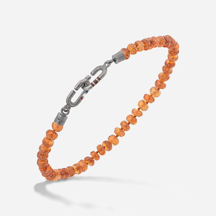 MARCO DAL MASO Link Mini Beads Eternity Bracelet featuring faceted orange citrine beads and a silver-tone link clasp, shown in an angled product view against a light background.