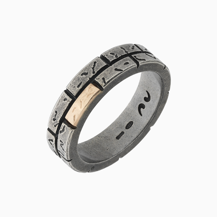 Textured dark metal ring with a contrasting gold-tone panel.
