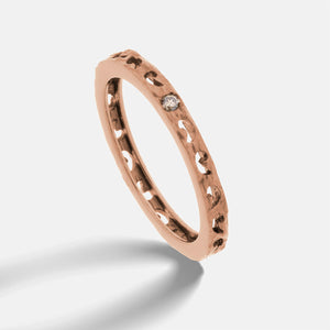 MARCO DAL MASO Orion Single Gemstone Ring in rose gold with a champagne diamond, shown in an angled product view with a textured band.