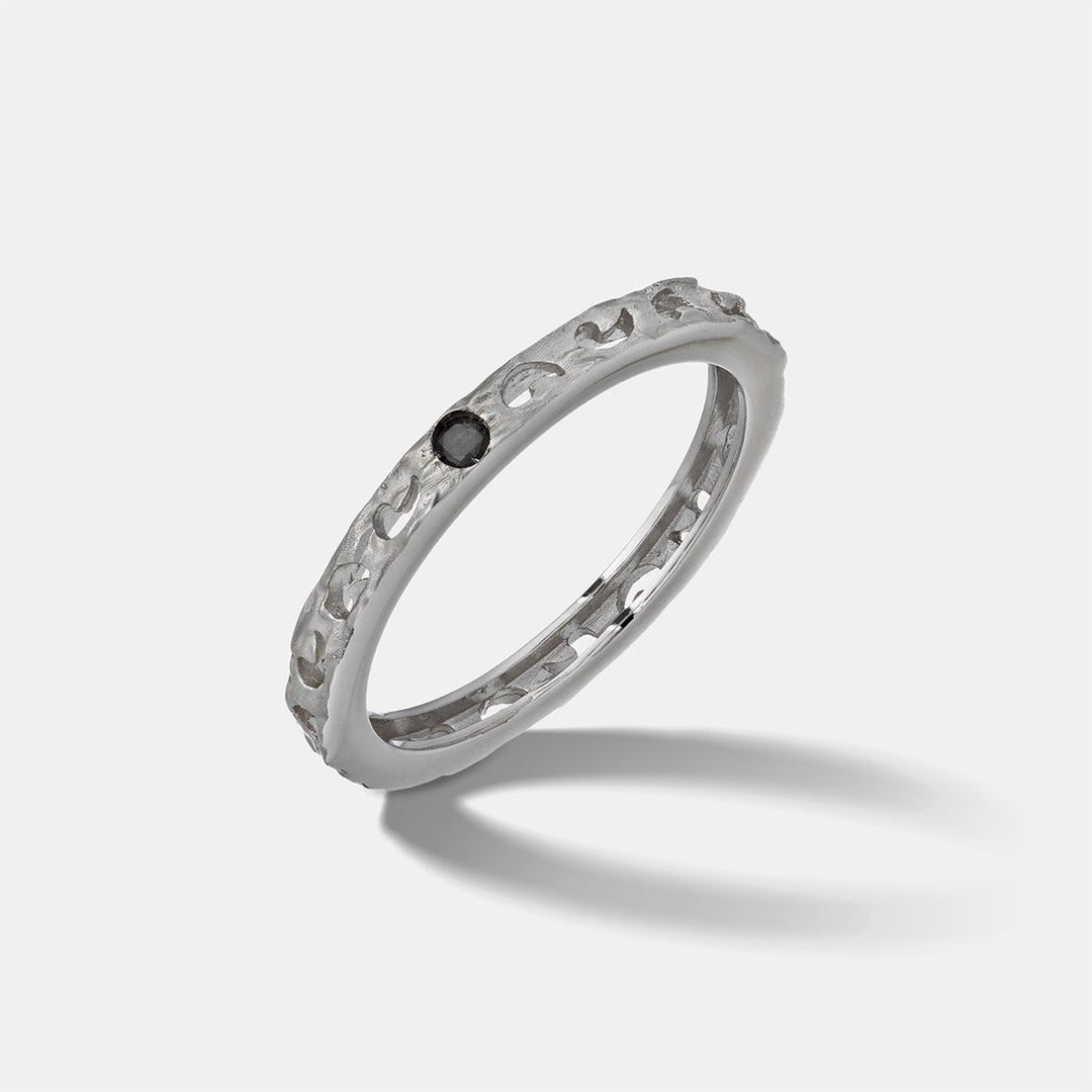 MARCO DAL MASO Orion Single Gemstone Ring in white gold with a black diamond, featuring a textured band and minimalist single-stone design, shown in an angled product view.