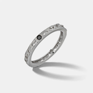 MARCO DAL MASO Orion Single Gemstone Ring in white gold with a black diamond, featuring a textured band and minimalist single-stone design, shown in an angled product view.