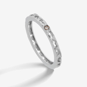 MARCO DAL MASO Orion Single Gemstone Ring in white gold, featuring a champagne diamond set within a textured band, shown in an angled product view against a white background.