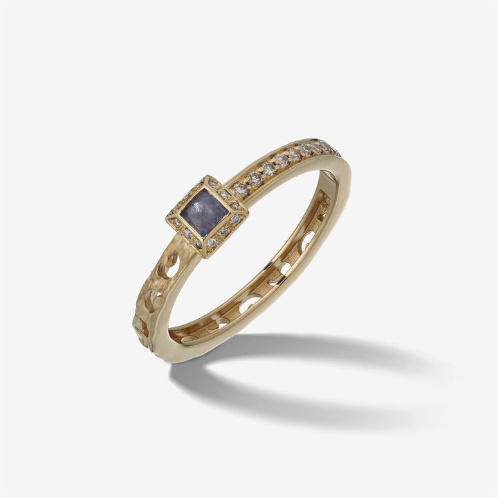 MARCO DAL MASO Orion Square Gemstone Ring in yellow gold, featuring a square blue sapphire surrounded by champagne diamonds and a textured gold band, shown in an angled product view.