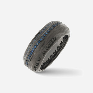 Dark ring with two rows of blue stones.