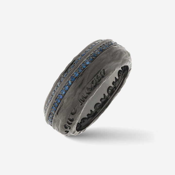 Dark ring with two rows of blue stones.
