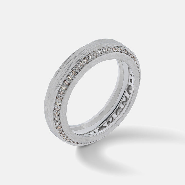 MARCO DAL MASO silver-tone textured ring with a row of clear stones.