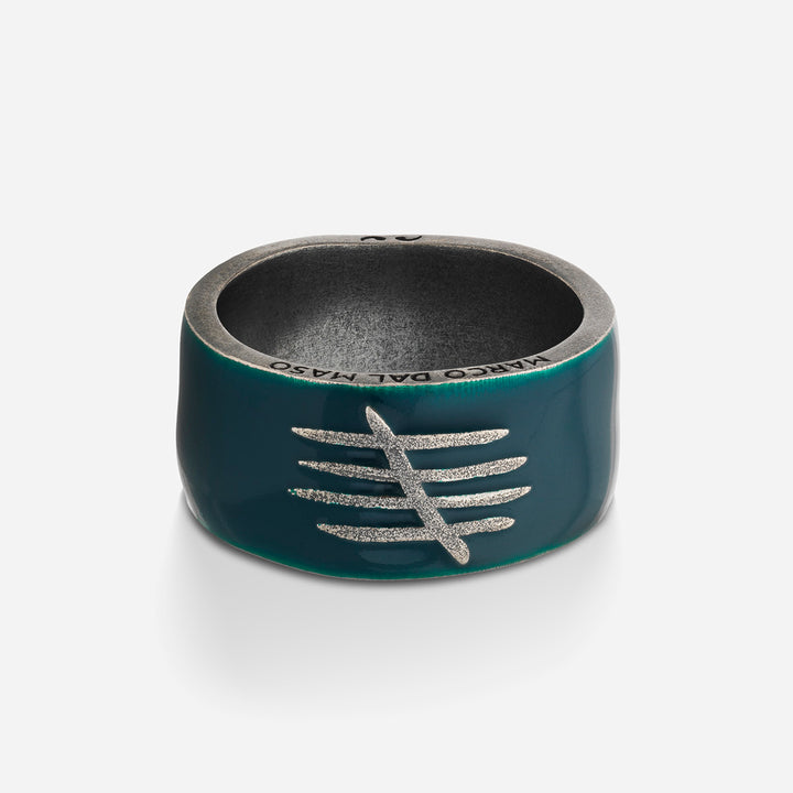 Front perspective of bold band revealing dark green finish on clear base.