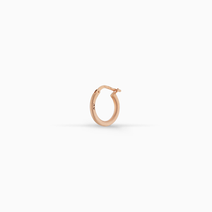 MARCO DAL MASO Ulysses Slick Hoop Earring in matte rose gold vermeil, featuring a minimalist circular design and hinged closure, displayed against a clean white background.
