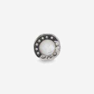 Gem ring in antique silver, white pearl, and stones on a plain white backdrop.
