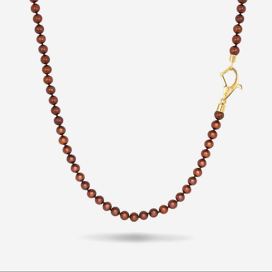 MARCO DAL MASO XOK Wave Mini Beaded Necklace featuring chocolate pearls and a gold-tone clasp, displayed against a light background.