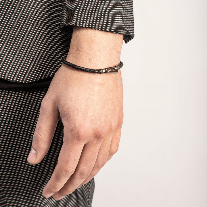 LASH Braided Bracelet in oxidized silver and black braided leather, worn on the wrist.