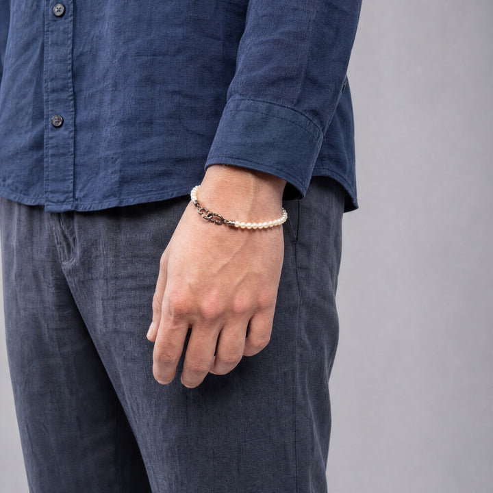 Model wearing the LINK Mini Beads Eternity Bracelet featuring pearl beads.