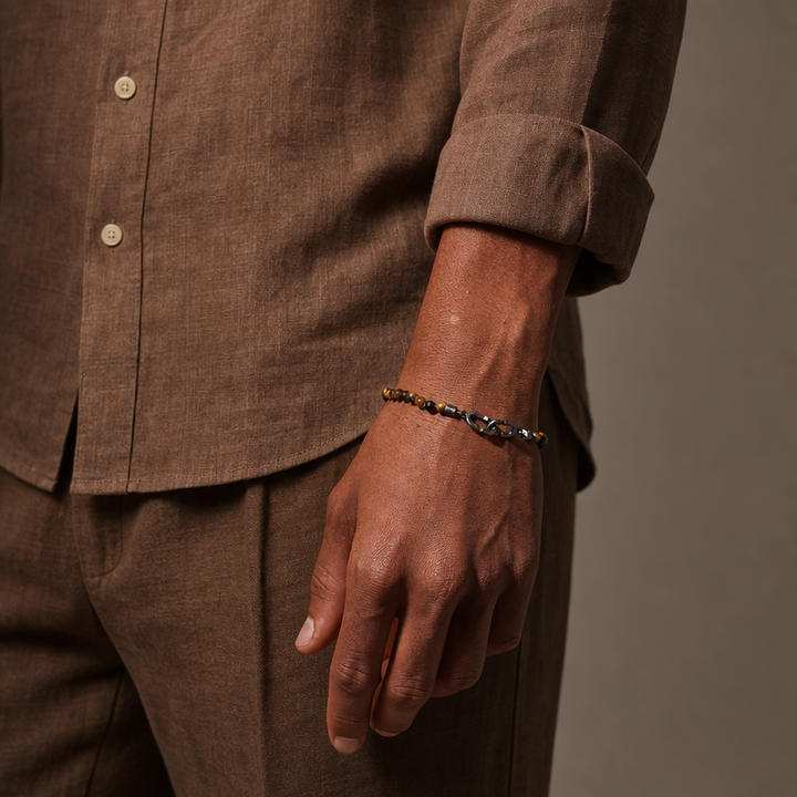 Model wearing the LINK Mini Beads Eternity Bracelet featuring red tiger eye beads.